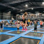 How to start a trampoline park: indoor trampoline court with jumpers during a timed session