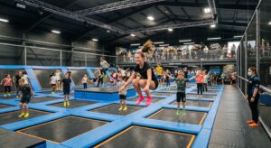 How to start a trampoline park: indoor trampoline court with jumpers during a timed session
